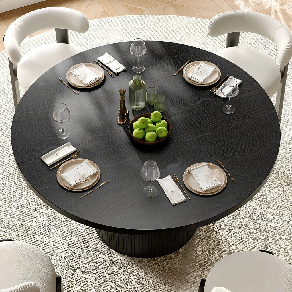 Black fluted round dining table — front angle