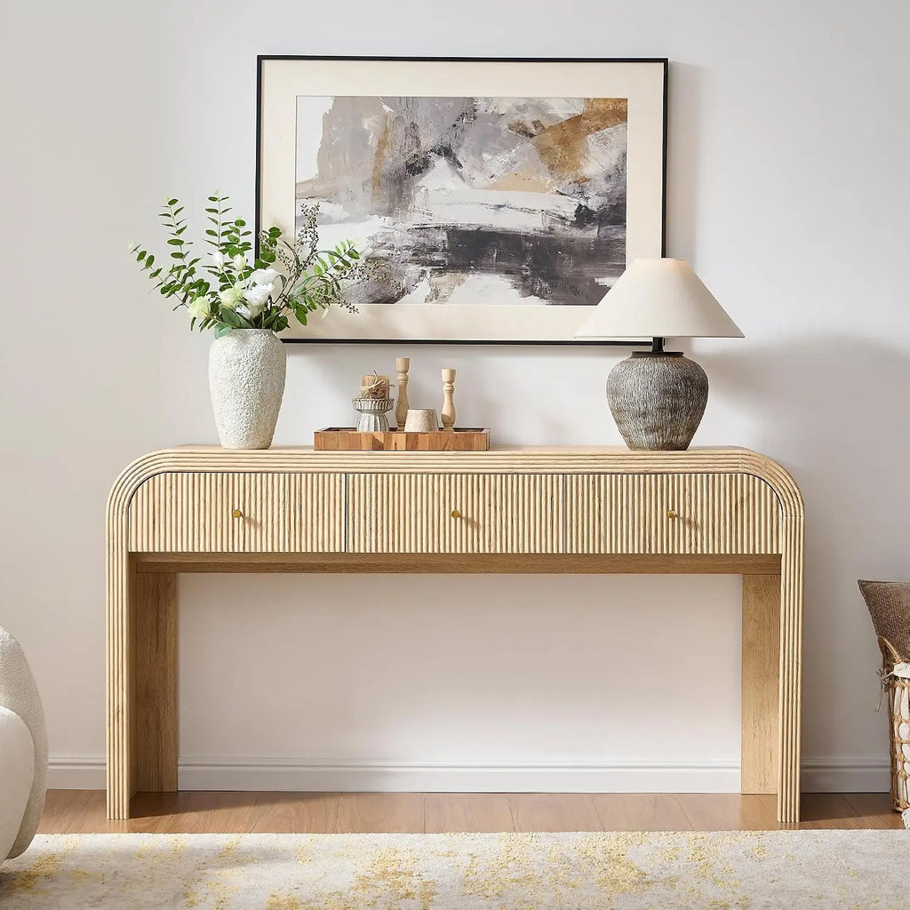 Curved fluted console table with three drawers and waterfall frame