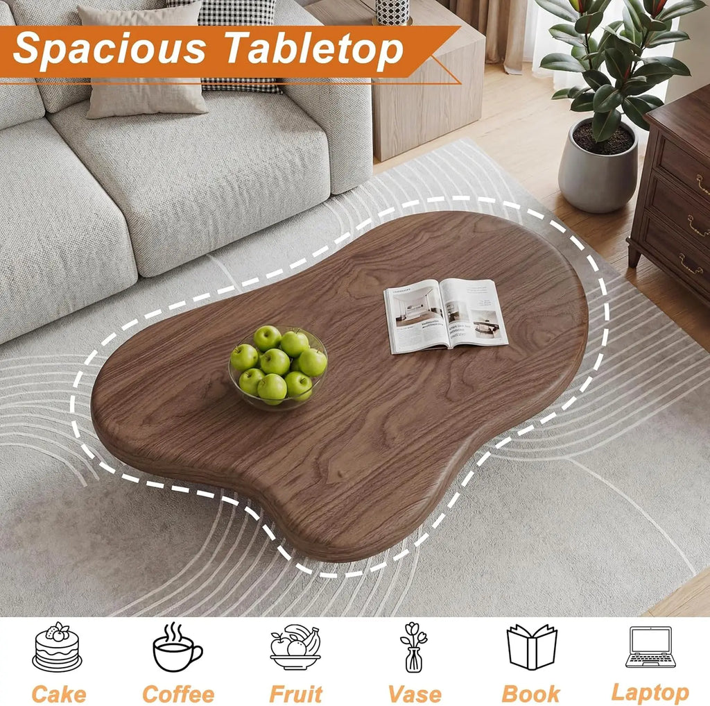 Modern cloud-shaped coffee table with drum legs in solid wood