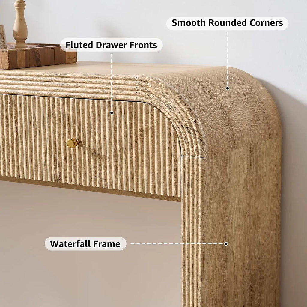 Curved fluted console table with three drawers and waterfall frame