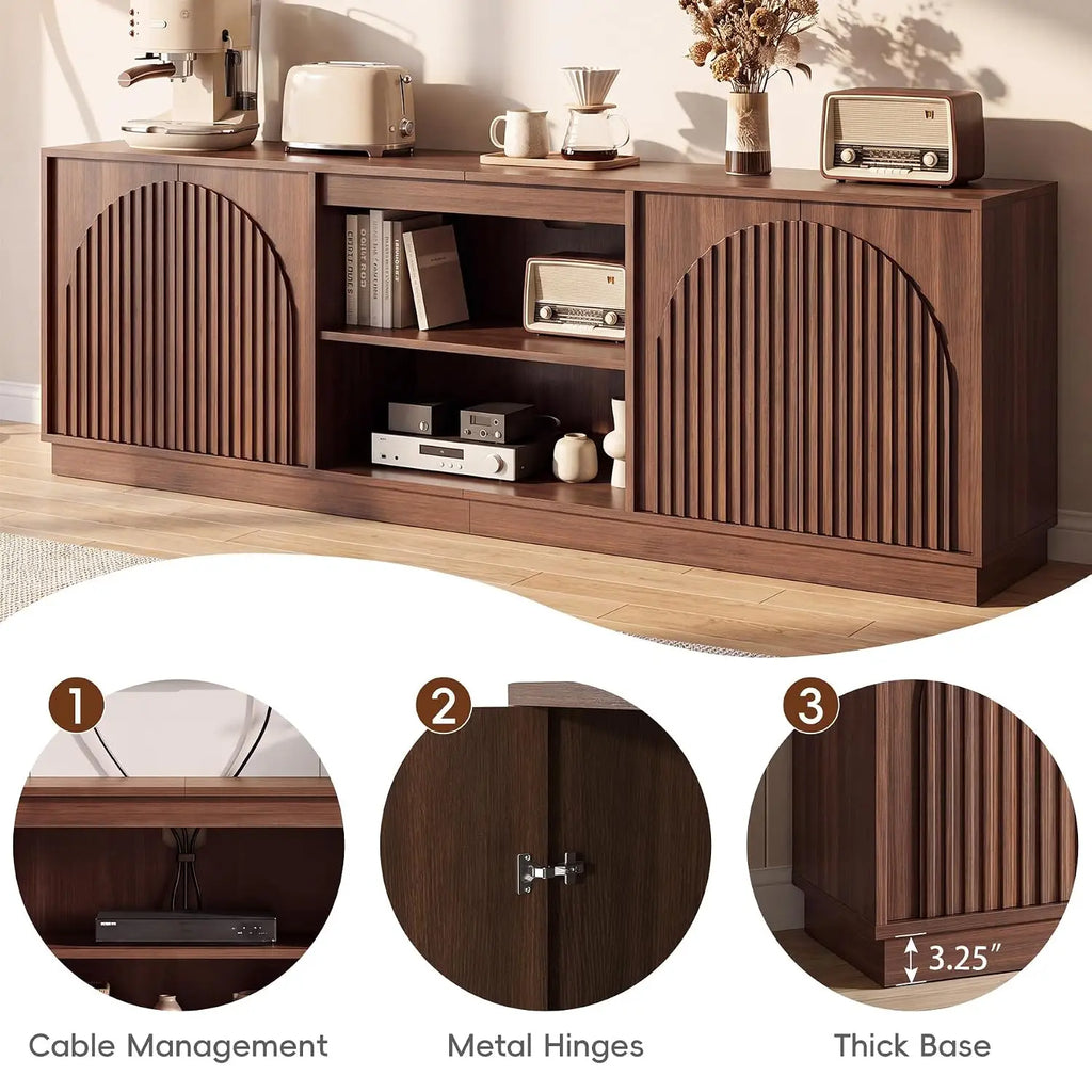 Fluted walnut TV stand with enclosed storage in a living room