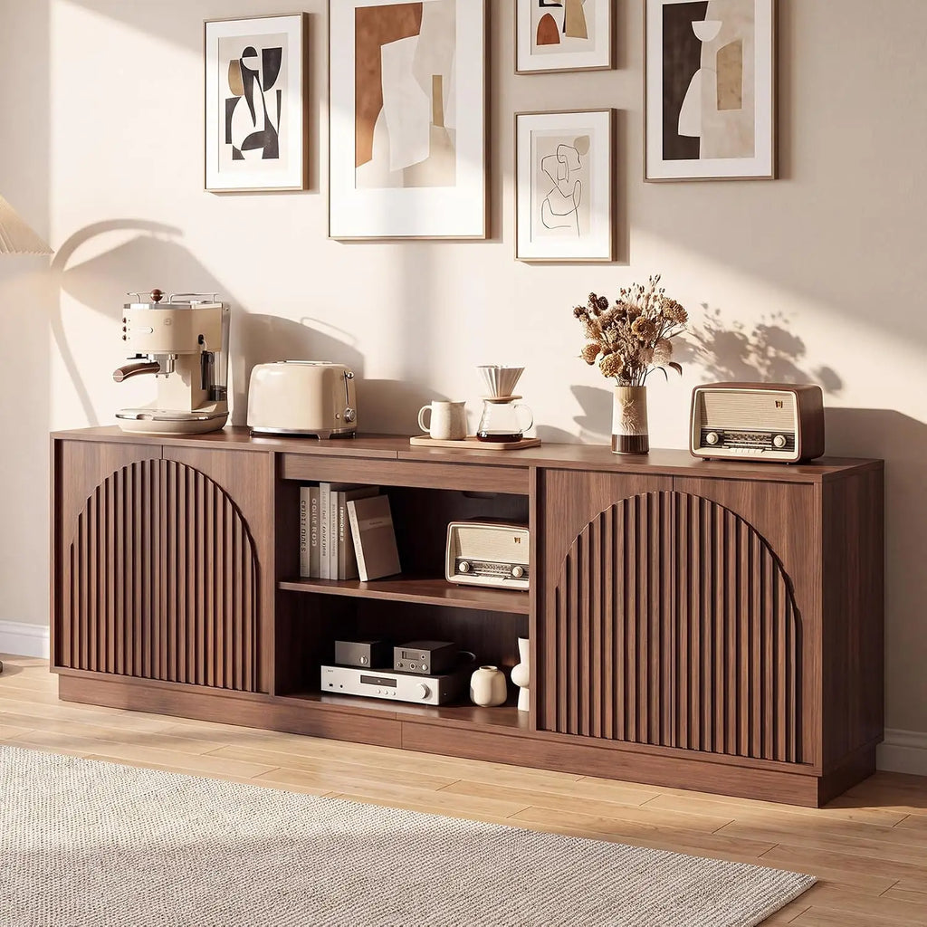 Fluted walnut TV stand with enclosed storage in a living room