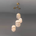Sculptural marble chandelier with brass and alabaster design