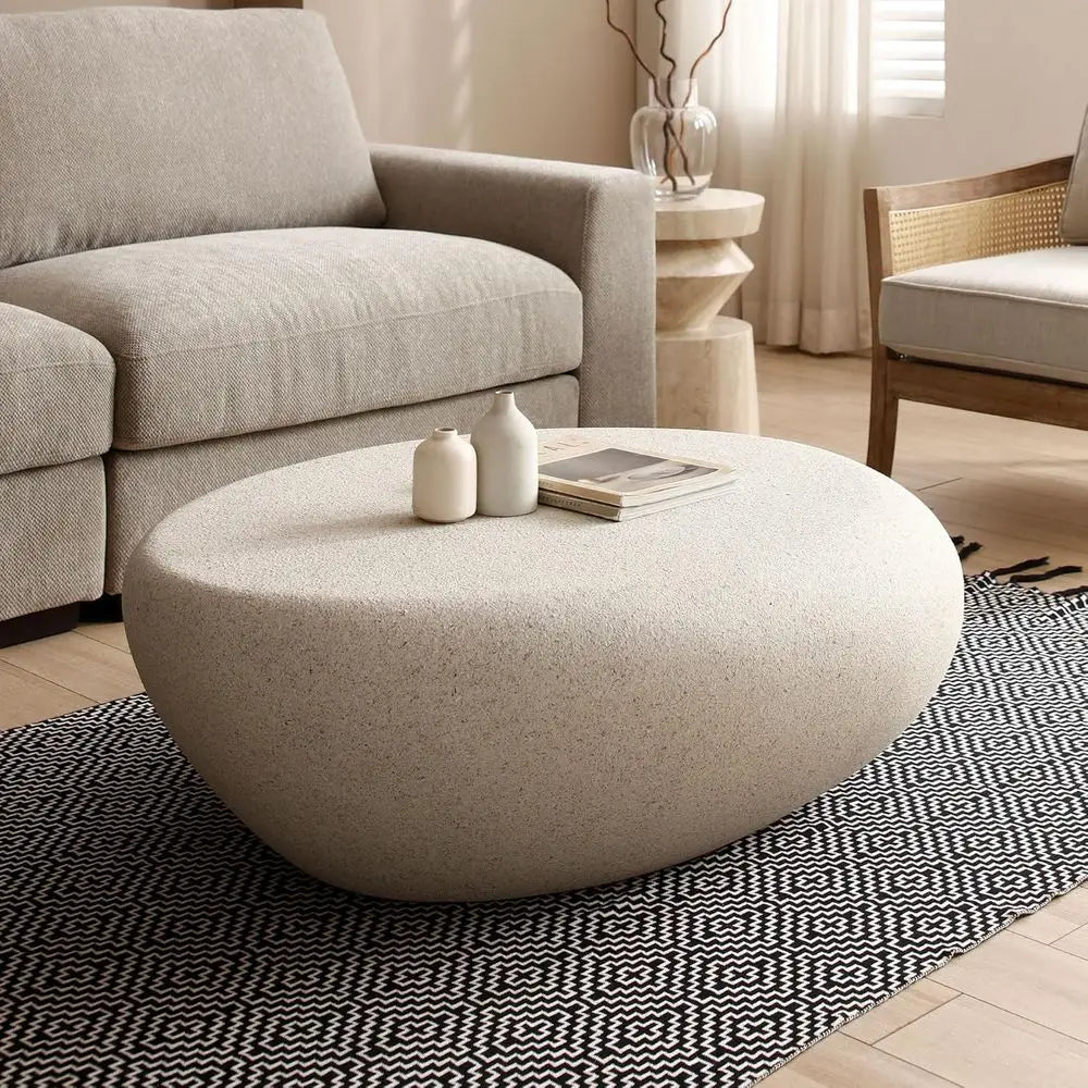 Oval stone coffee table — front detail view