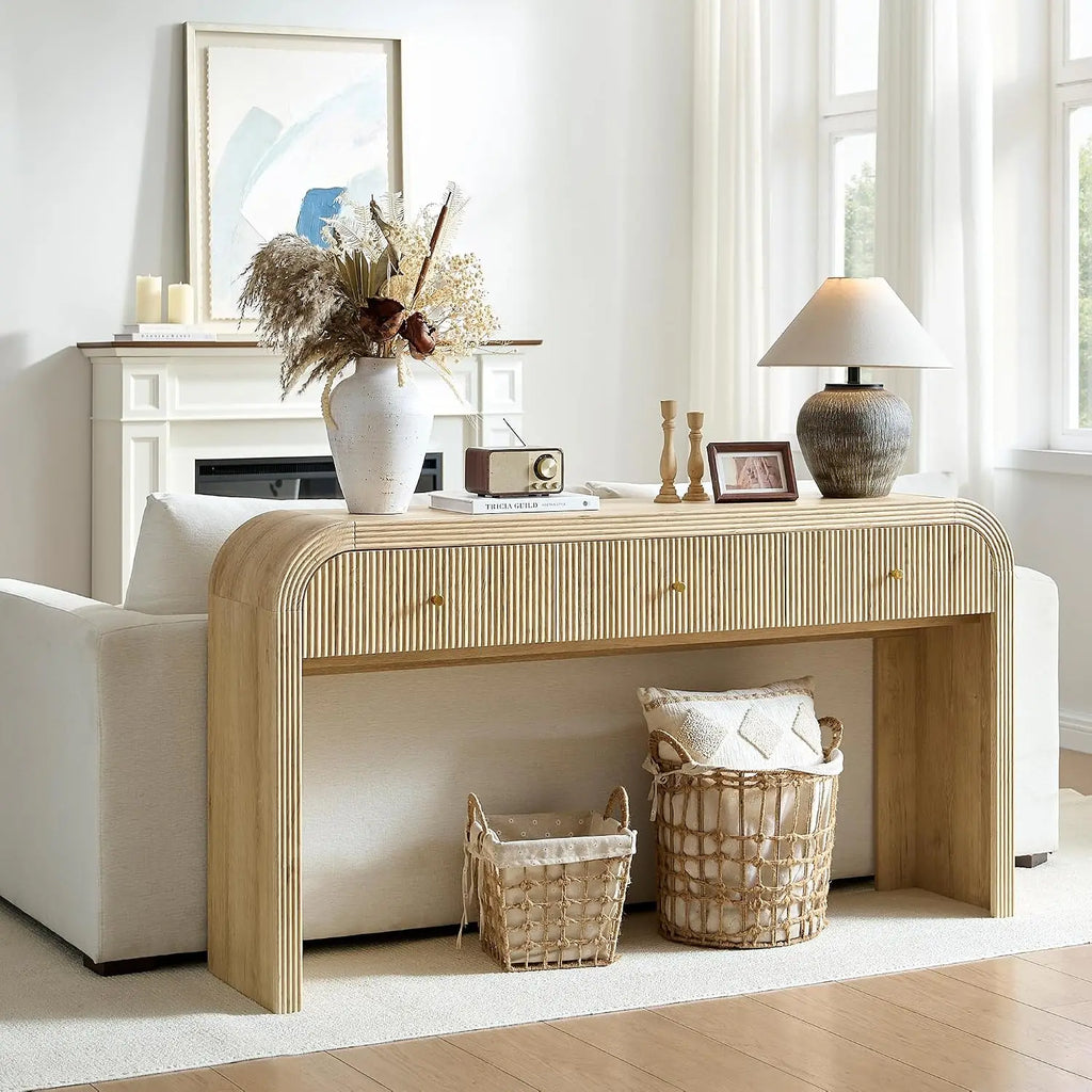 Curved fluted console table with three drawers and waterfall frame