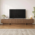 Fluted walnut TV stand, 98 inches, in a living room setting