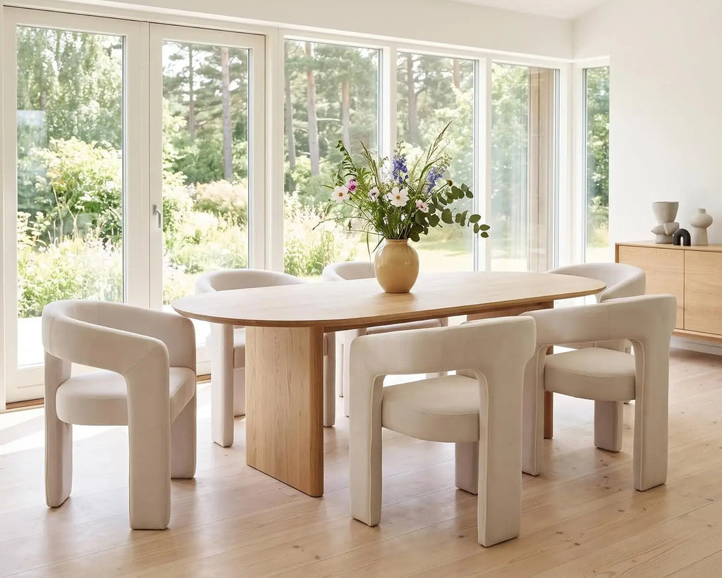 Modern linen-upholstered barrel dining chair with arms