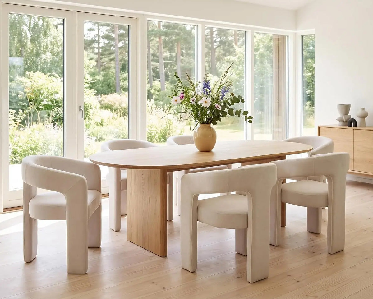 Modern linen-upholstered barrel dining chair with arms