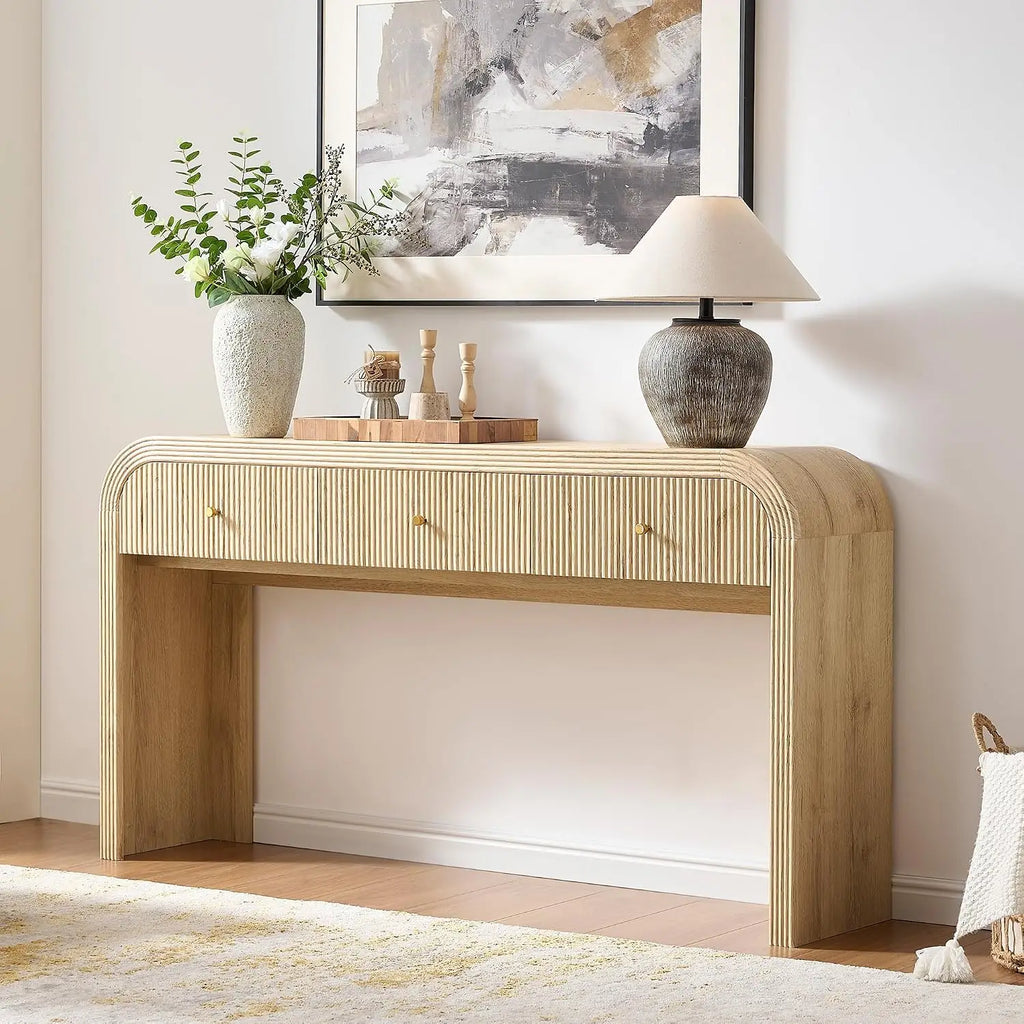 Curved fluted console table with three drawers and waterfall frame