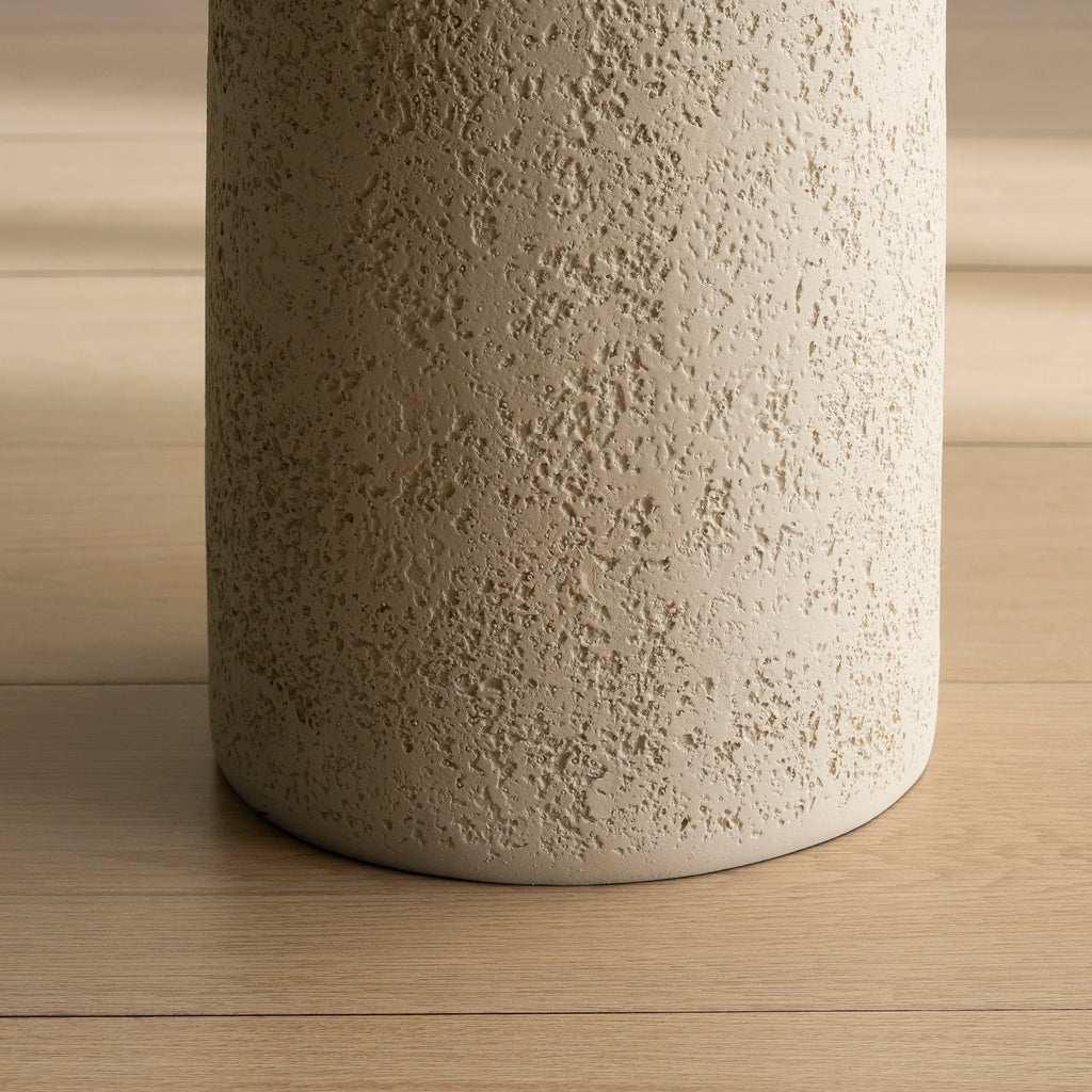 SHYFOY pedestal side table with stone-inspired hourglass base